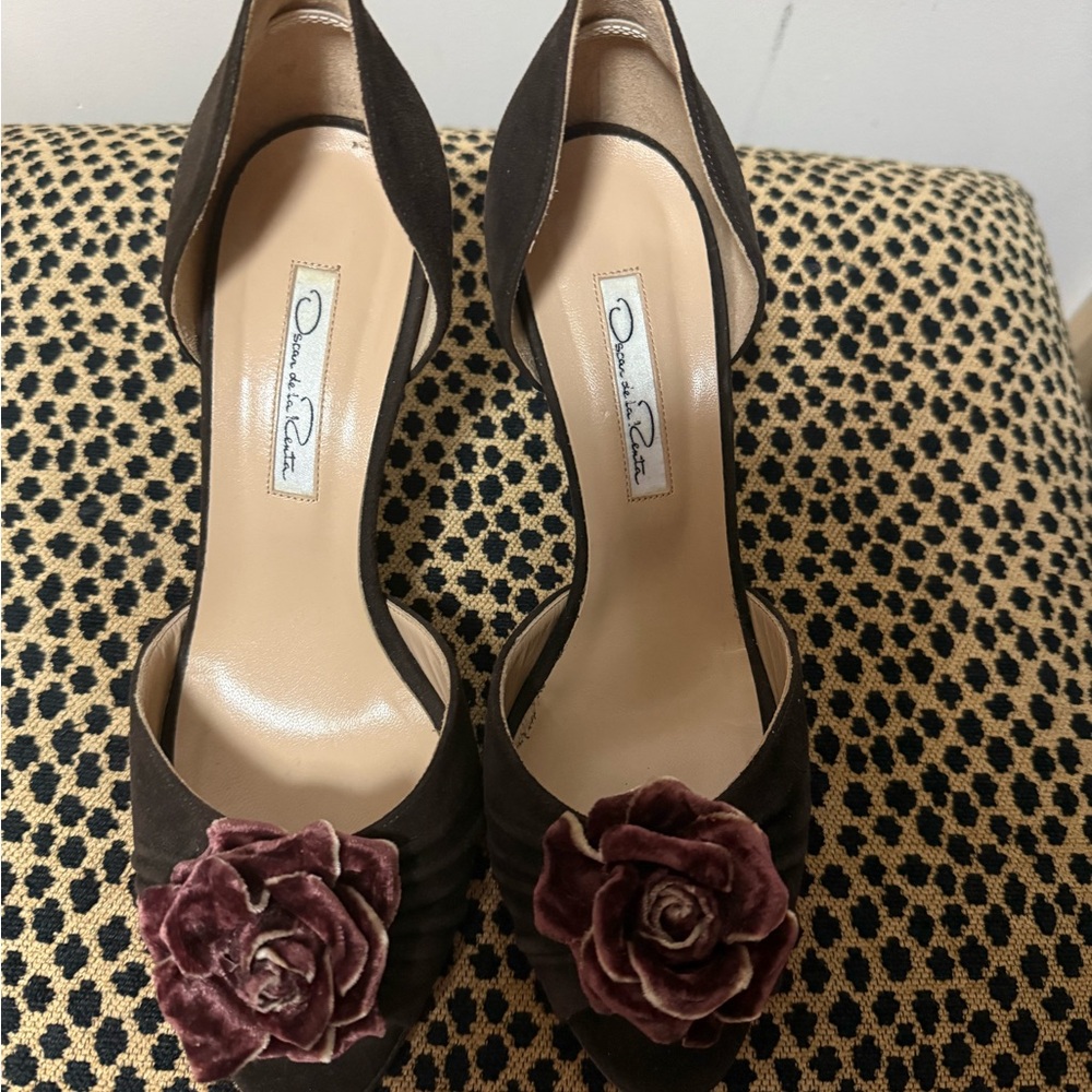 Beautiful brown suede shoes with accent flower.  Leather soles